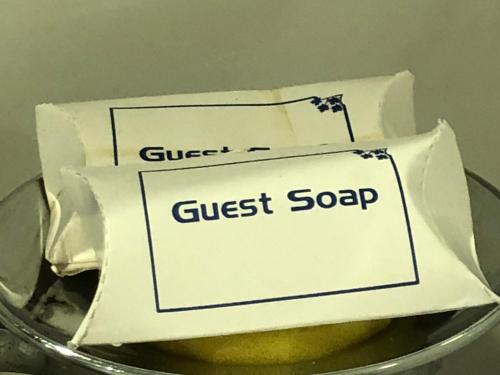 a cake with a guest soap on top of it at The Neem in New Delhi