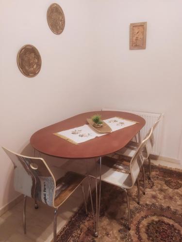a dining room table with chairs around it at MARIOS HOUSE 1 in Xanthi