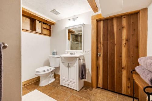 a bathroom with a toilet and a sink at Marshall Street Music Retreat in Boise