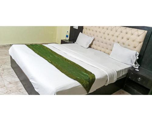 Cama ou camas em um quarto em Hotel Pacific Green By WB Inn