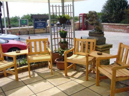 a statue of a dog sitting next to a fountain at Monterey Beach Hotel in Lytham St Annes