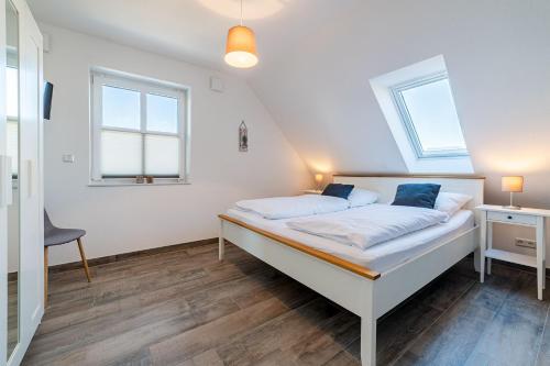 Postel nebo postele na pokoji v ubytování Nordseeperle
