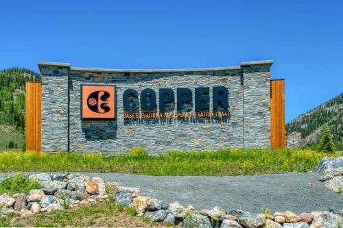 a sign for the copper sign at a ski resort at Ten Mile Haus in Frisco