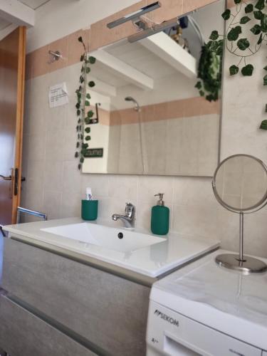 a bathroom with a sink and a mirror at casa S Leonardo in Crotone