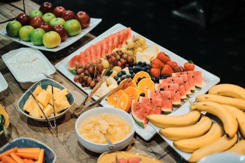 a table topped with lots of different types of fruit at Hotel De Normandie in Saint Helier Jersey