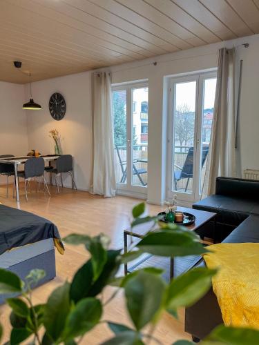 a living room with a couch and a table at Schöne moderne Wohnung Smart Tv in Waldstetten