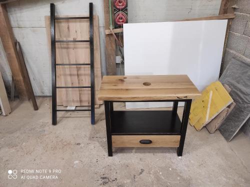 a wooden desk sitting in a room next to a shelf at Marco Polo in Novi Travnik