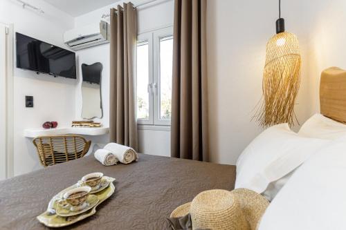 En eller flere senge i et værelse på Casa Verde Di Naxos