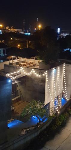 a building with lights on it at night at Villa by the Win Pattaya in Jomtien Beach