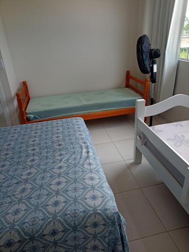 Llit o llits en una habitació de Apartamento à 300 mts da praia