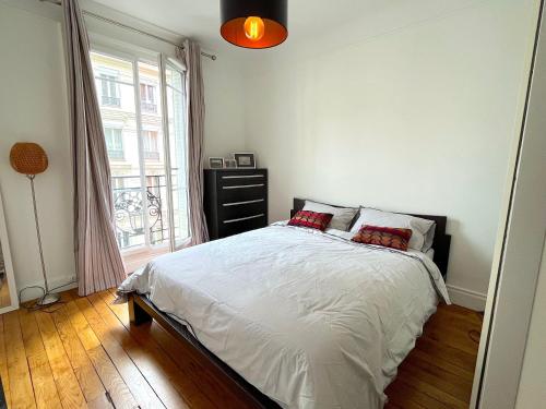 Posteľ alebo postele v izbe v ubytovaní L'appartement Lecourbe