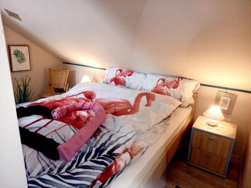 a bedroom with a bed with animals on it at Lazy Bee in Keszthely