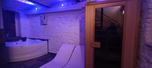 a bathroom with a white tub and a sink at 10 PERCENT OFF UNTIL 31ST OF OCTOBER - Old Café Spa Apartment in Belgrade