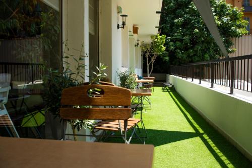 a row of tables and chairs on a balcony at Campanile Hotel Nice Centre Acropolis in Nice