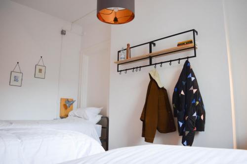 a bedroom with two beds and a basketball hanging on the wall at The Bristol Wing in Bristol