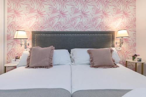 Una cama o camas en una habitación de nüa alameda