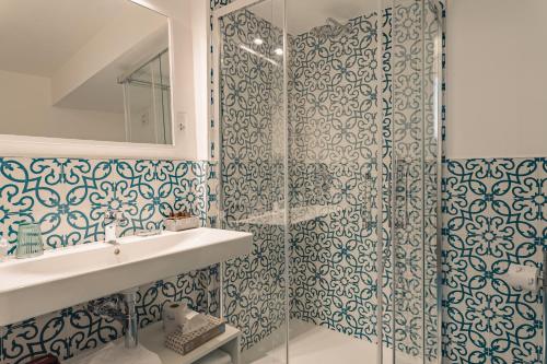 a bathroom with a shower and a sink at Il Vicolo Relais in Sirolo