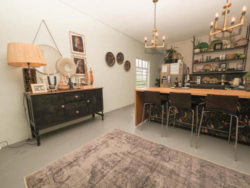 a room with a counter and a sink and a table at Fever Tree Guesthouse in Hillcrest
