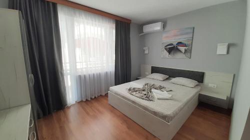 Postel nebo postele na pokoji v ubytování Laguna