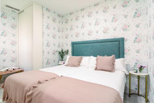 Una cama o camas en una habitación de nüa alameda