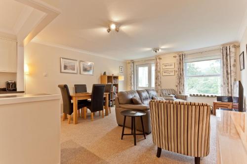 a living room with a couch and a table at Herdwick Place Langdale Valley in Great Langdale
