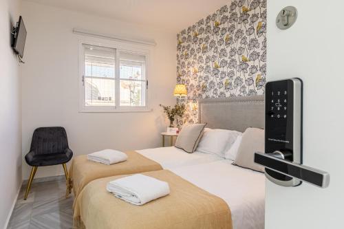 Una cama o camas en una habitación de nüa alameda