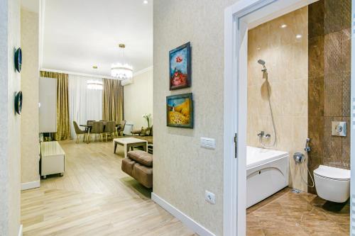 a bathroom with a sink and a toilet in a room at Luxury House in Nizami Street in Baku