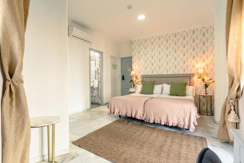 Una cama o camas en una habitación de nüa alameda
