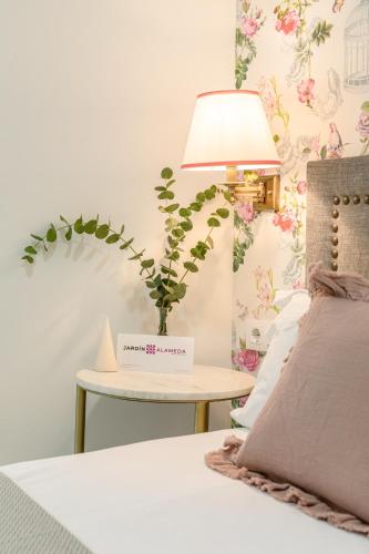 Una cama o camas en una habitación de nüa alameda