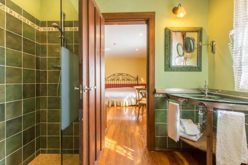 a bathroom with a shower and a sink at El Rincón de Rascafría in Rascafría