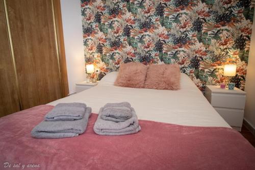 Giường trong phòng chung tại Estudio frente al mar