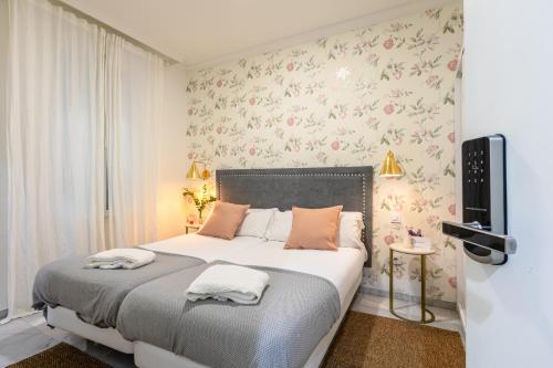Una cama o camas en una habitación de nüa alameda