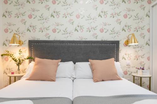 Una cama o camas en una habitación de nüa alameda
