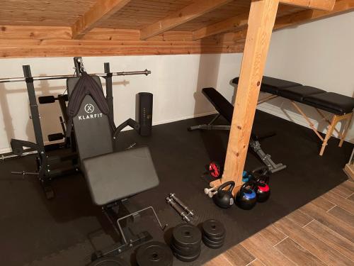 an overhead view of a gym with a chair and weights at Ranch Falcone in Hrvatska Dubica