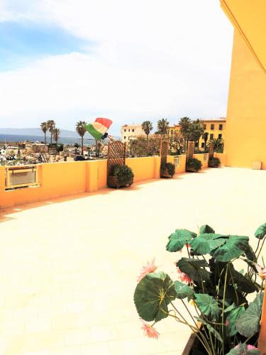 a view from the roof of a building with a plant at Hotel Don Pedro in Portoscuso