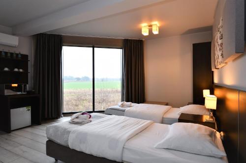 Cama o camas de una habitación en Sleepinn Gdansk Airport