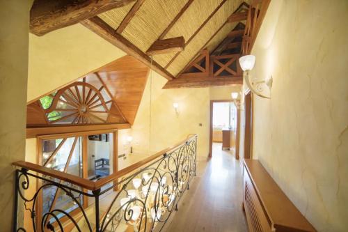 a staircase in a house with wooden ceilings at Top Mountain Villa in Wisła