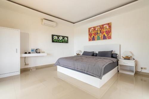 Кровать или кровати в номере Pini Sentana Village Nusa Penida