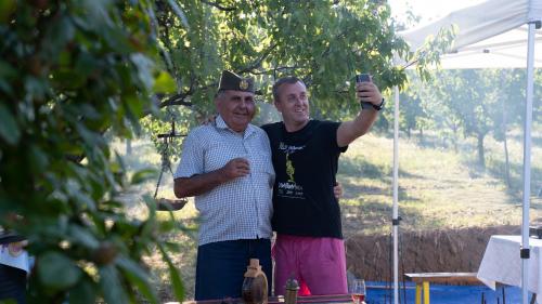 two men standing next to each other holding a cell phone at Vinogradski konak Belgrade, Sopot,Kosmaj in Sopot