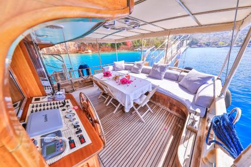 a table on the deck of a boat in the water at Blue Cruise in Kas