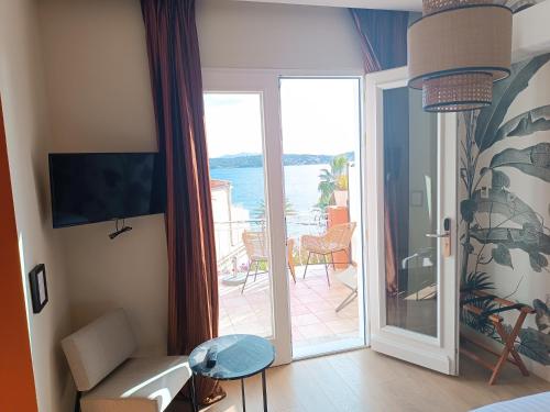 a living room with a view of the ocean at Les Galets Hôtel et B&B in Bandol