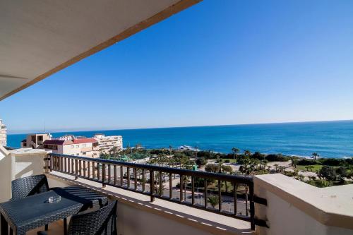 a balcony with a view of the ocean at Hotel Playas de Torrevieja in Torrevieja
