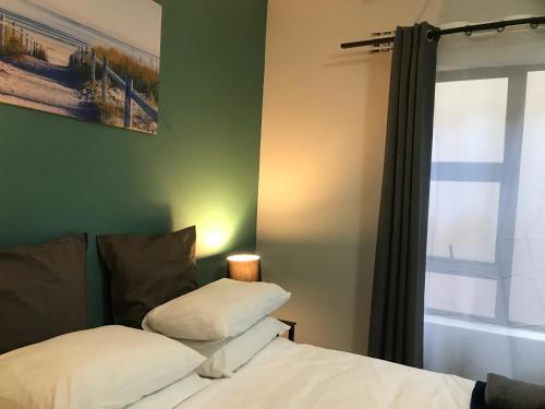 Katil atau katil-katil dalam bilik di Aluve Guesthouse