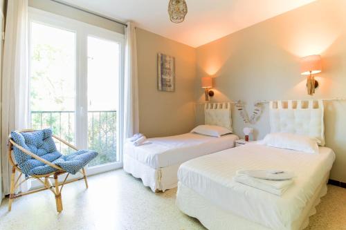 Postel nebo postele na pokoji v ubytování SELECT'SO HOME - Appartement vue mer - Services hôteliers & Prestations de qualité - FAV-LS