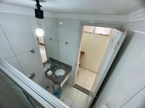 an overhead view of a bathroom with a sink and a mirror at Diroma Resort com um dia no Acqua Park in Caldas Novas
