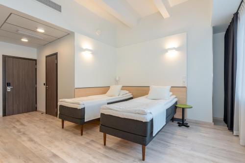 Postel nebo postele na pokoji v ubytování Art Hotel Pallas by Tartuhotels