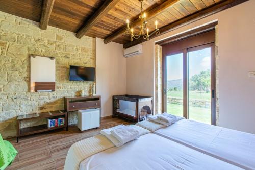 Ένα ή περισσότερα κρεβάτια σε δωμάτιο στο Villa Elena Chania