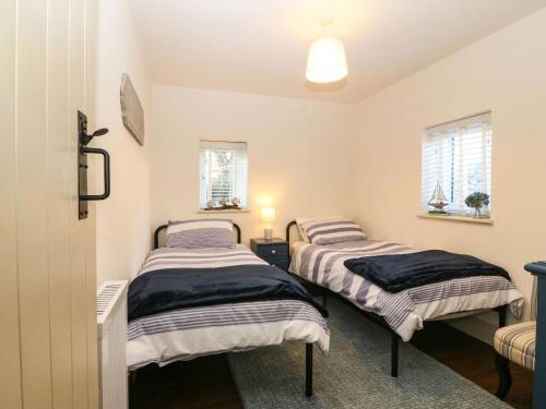 Postel nebo postele na pokoji v ubytování Brook Cottage