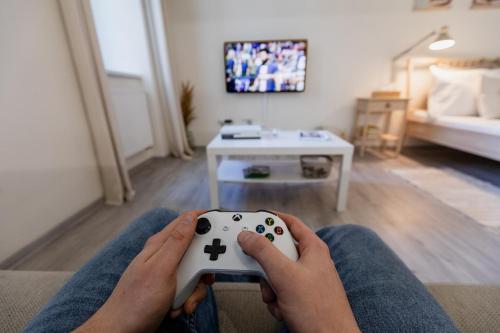 Télévision ou salle de divertissement dans l'établissement BOHO RÁJ v centru / /gril/ /balkón