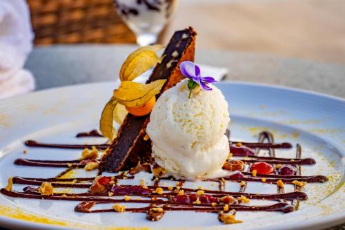 a piece of dessert with ice cream on a plate at Laghetto Canela in Canela